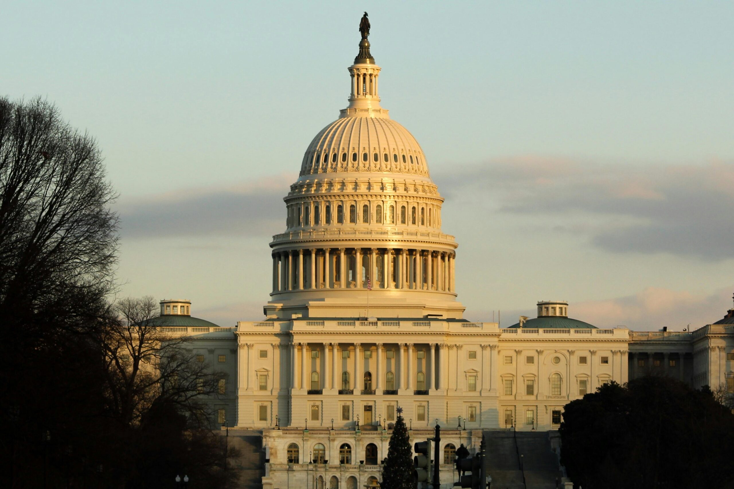 View of the US Capitol Building in Washington D.C. during sunset, highlighting its iconic architecture.